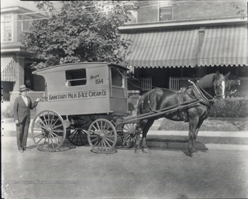 Wagon and salesman are likely standing in front of 253 Park Street in Morgantown, W. Va.