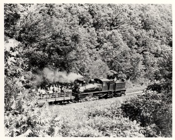 Shay No. 4 pushing passenger cart up a hill. Cass Scenic R.R.; Cass, W.V.