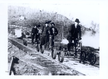 "Doc" Hannah on first speeder; Blackhurst; Long before cycling grew to widespread popularity, company officials and doctors used 'speeders' in conducting business.  They were also handy means of seeing the wonderful mountain scenery on Cheat Mountain. Hannah, Va.