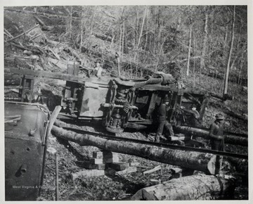 Men working on wrecked train.