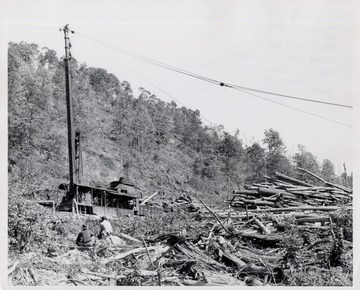 Log skidder and log piles.