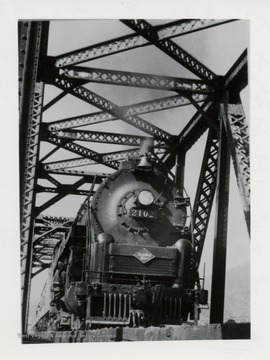 Train engine 2102 on a bridge.