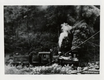 Side view of a train engine.  Picture taken from 2nd level of boiler room of the mill.  