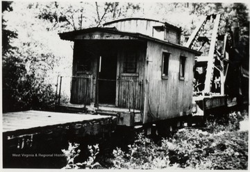 In front, Mower Lumber Company skidder on yard siding.   