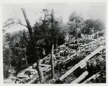 Large group of men posed on the Skidway.   