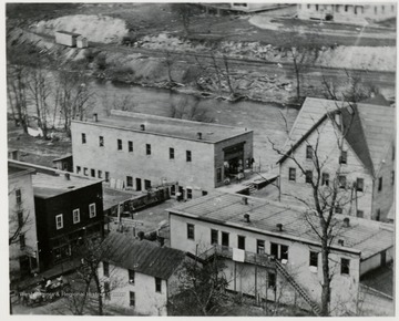 Aerial view of East Cass showing 'Shorty's Restaurant' and buildings along side the river. 