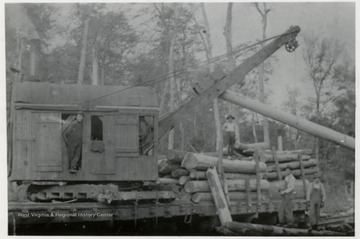 Log loader with crew. "This is the way they load logs on the Elk River.  S.G." 