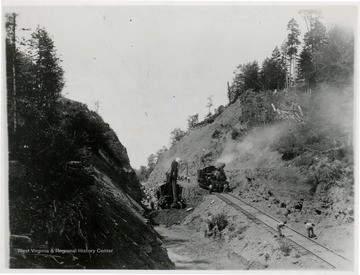 Marion steam shovel and Shay No. 10 in Big Cut, one mile from Spruce on Elk River.  Shay No. 10 is giving the shovel water.  Robert Dean of Sayre, Pa. says on back of original pix that he hauled there from start to finish.