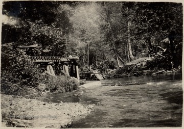 Bridge over the Back Fork of the Elk River gave way dropping the engine into the river.