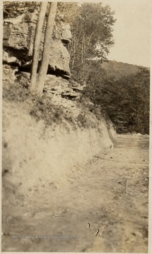 Road cut into hillside.