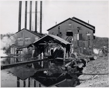 Back of the mill.  Log slide down to the log pond.