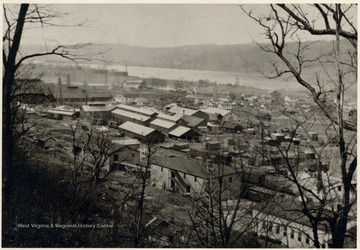 The town of Sistersville.  Oil derricks off in the distance.