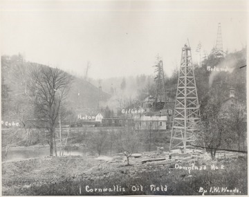 Oil Derricks McCabe, Rolan, Gilbert, Roland, and Douglass No. 2 amongst homes at Cornwallis.