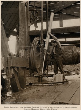 James Thompson, the Veteran Shooter, placing a twenty-quart nitro-glycerine shell.  Harrison County Oil Fields.  