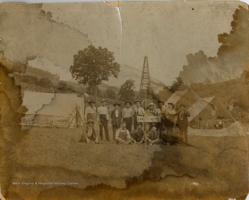 Standing left to right Pearl Roby, Noah Moore, George Burriss, Lem South, Judge tennant, Mont Tucker, Burl Tennant, Bill Taylor, (Visitor name not known). Sitting Charley Myers, Herbert Lapoe, Mr. Wilson, and Mr. Aultman. 