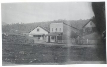 Buildings beside a train track.