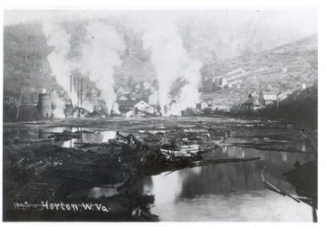 A distant view of Horton, W.VA. in the early 1900's.  A log pond in the foreground and lumber mill are visible.