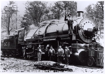 Western Maryland Engine 954, old engine used on the Hendricks.  Crew posed beside and on engine.