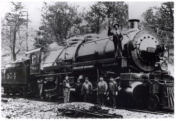 Western Maryland Engine 954, old engine used on the Hendricks.  Crew posed beside and on engine.