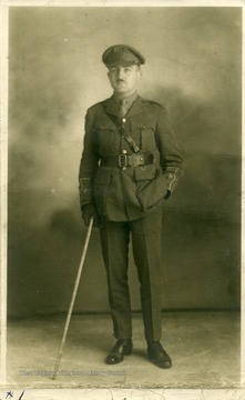 Portrait of Lt. Louis Bennett, Jr., R.F.C.  This photograph, as well as others (numbers 001378, 001379, and 001380) are referenced in a letter from Mrs. Ethel Mills to Mrs. Louis Bennett, Sr. The text of the letter is as follows: August 20, 1919 Drokes, Beaulieu, Hants My Dear Mrs. Bennett, I just want to reach across the channel, and take your hand and hold it, in a great understanding silence! To begin with, you could not have had my address if your dear boy had not given it!  I hope you will be coming to England [and] will come to us for a few days.  And get to know his old surroundings here -- where he lived [and] bunked.  I remember I was at work building a pig stye! -- when suddenly he appeared flying round [and] round my house and suddenly he made the most beautiful desent [sic] and stood before us, with his handsome face glowing, 'I’ve come to say good bye' -- he could only stay for ½ an hour -- and we mutually photographed each other -- then he was gone, saying 'I’ll send back my photo for you all to sign.'  He had no sooner gone, than I grieved I hadn’t asked him for your address, so as to send you any of ours that might be good, as I knew how you’d love to have as many snapshots as possible, but hoped I’d soon hear from him.  Well at last I did write -- the photo I had to wait sometime to get a signature -- [and] something made me write to him without returning him his [and] ours --  fearing he had moved from his last address -- so I said do tell me if this reaches you before I send the precious photos.'  And I waited, [and] as time passed, I feared he had gone to join with those other warriors!  Then came the trying to find you, [and] send you these precious snapshots. [and] so when I saw your envelope, before I opened it, or had even turned it round, I knew what its contents must be [and] I just felt greatful that evidently he looked upon us as friends, [and] so had given you my name and address.  You will let me see you should you come to England won’t you -- [and] if possible you will come down to Bealieu [and] be with us for a little while. I will not write more tonight -- but with true love [and] the deepest sympathy to Mr. Bennett and yourself. Yours affectionately Ethel Mills You will want his letter too.  You will see the fine way he agitated to get to France and to be fighting!