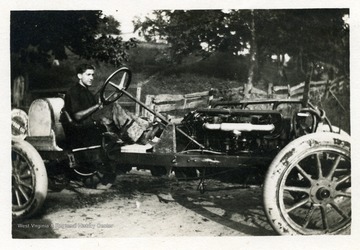 Louis Bennett, Jr. driving his car at approximately age 12.  See 'Cross and Cockade Journal' vol. 21, no. 4, winter 80 (West Virginia Collection Pamphlet no. 14277) for an identification on candid portrait of Bennett in car.