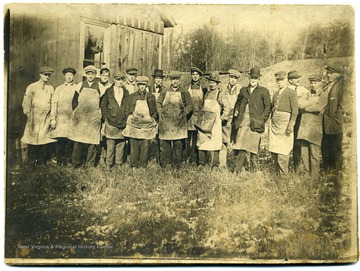 Group portrait of glass workers.  Carl Heinty, Duivillie, Clark Dunn, Carl Johnson, Thomas, Dunn, Earl Bollinge, Walter Reitz, Occan Strom, Louie House, Altman-Packer, Charles Nixon, Charles Fish, Charles Clark, Herbert Heintz, Fred Laurence, Harry Nixon, William Faul.  