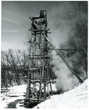 A salt well derrick in the midst of winter.