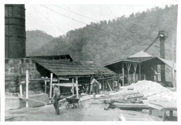 Picture of shed, smokestack is on left, grainer is behind. Coal brought in here. Small Stack on right is storage for cinders.