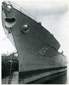 View of the bow of the U.S.S. West Virginia as its parts are scrapped at Todd Shipyards, Seattle, Washington.