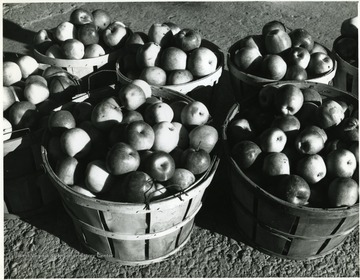 Apples in baskets.