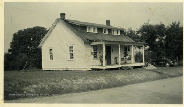 House in Pocahontas County after Outside Improvement project. This farm woman remarked, 'A house is no harder to paint than a piece of furniture. It just takes longer.' Most of the labor was done by this woman herself.  (See photograph number 001558 for view of home before renovations.)