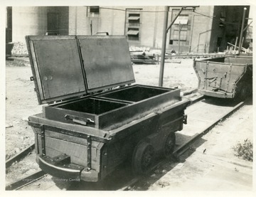 Railcars for hauling dynamite and blasting caps.