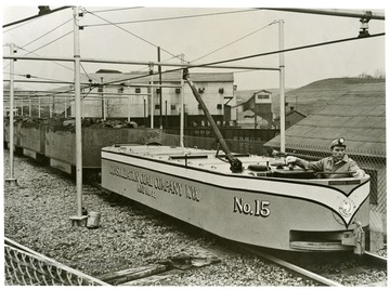 Picture of a man driving the No. 15 electric differential locomotive of the Pittsburgh Consolidation Coal Company, at Mine No. 32, W. Va. 