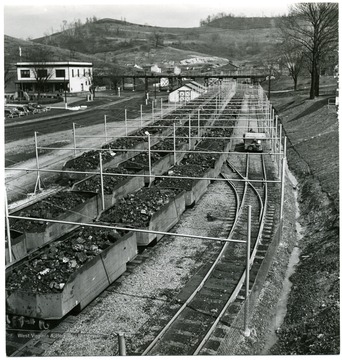 Filled coal cars outside of an unknown mine. Credit must be give to William Vandivert, 21 East Tenth St., New York 3, N.Y.