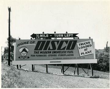 Road sign advertising coal and showing the way to get to the Disco plant. Pittsburgh Consolidation Coal Company.