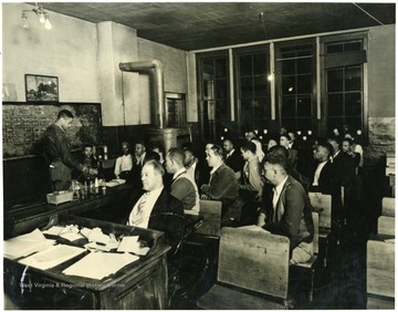 The first mining class being taught by U.G. Carter in Logan County, 1938.