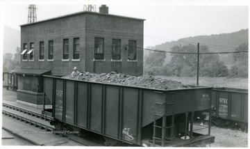 Western Maryland coal car with man on board.