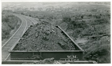 Scenic view of a community visible from the last Western Maryland coal car traveling past it.