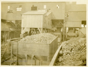 Loaded coal cars outside preparation plant.