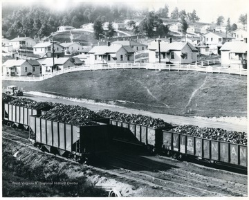 Virginian and C&amp;O coal trains outside of a coal town. 