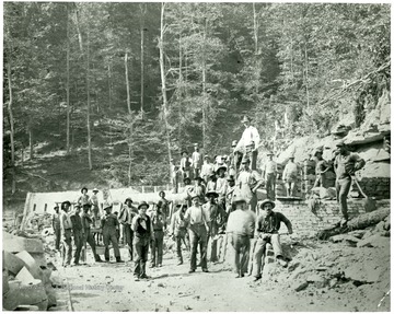 Men working at erecting Bee Hive Coke ovens maybe near Fairmont, W. Va. 