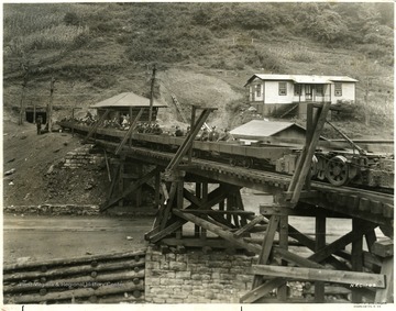 Miners ready to go to work in mine cars.