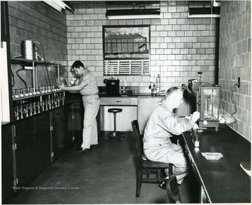 Two men at work in a quality control lab.