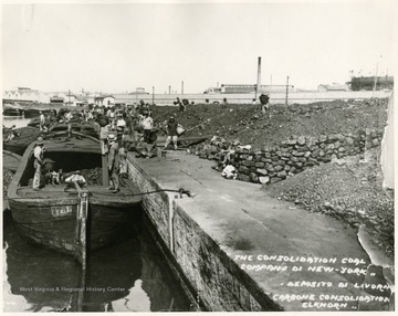 Caption on back reads, 'Pittsburgh Consolidation Coal Company, the largest operationg coal company in the world.  This picture shows the company unloading coal in Livorno, Italy.'