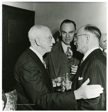 Three coal officials talking during a Consolidation Coal Co. Inspection trip.