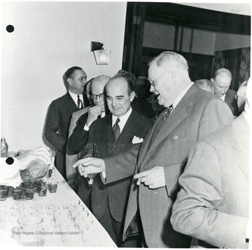 Coal officials getting drinks during a Consolidation Coal Co. Inspection trip.