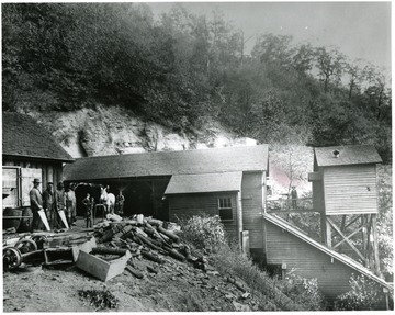 Men standing outside of the No. 2 Head House of the Thurmond Coal Co.