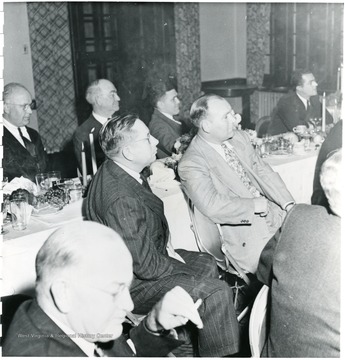 Coal officials listening to speech at dinner during a Consolidation Coal Co. Inspection trip.