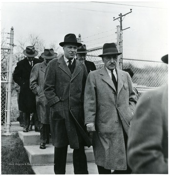 Group of men walking outside during a Consolidation Coal Co. Inspection trip.