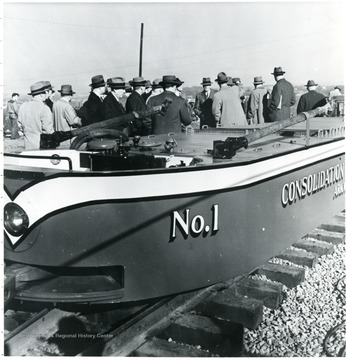 A Mine Shuttle Car is in the foreground.